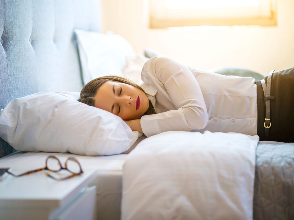 Traveler sleeping in hotel room