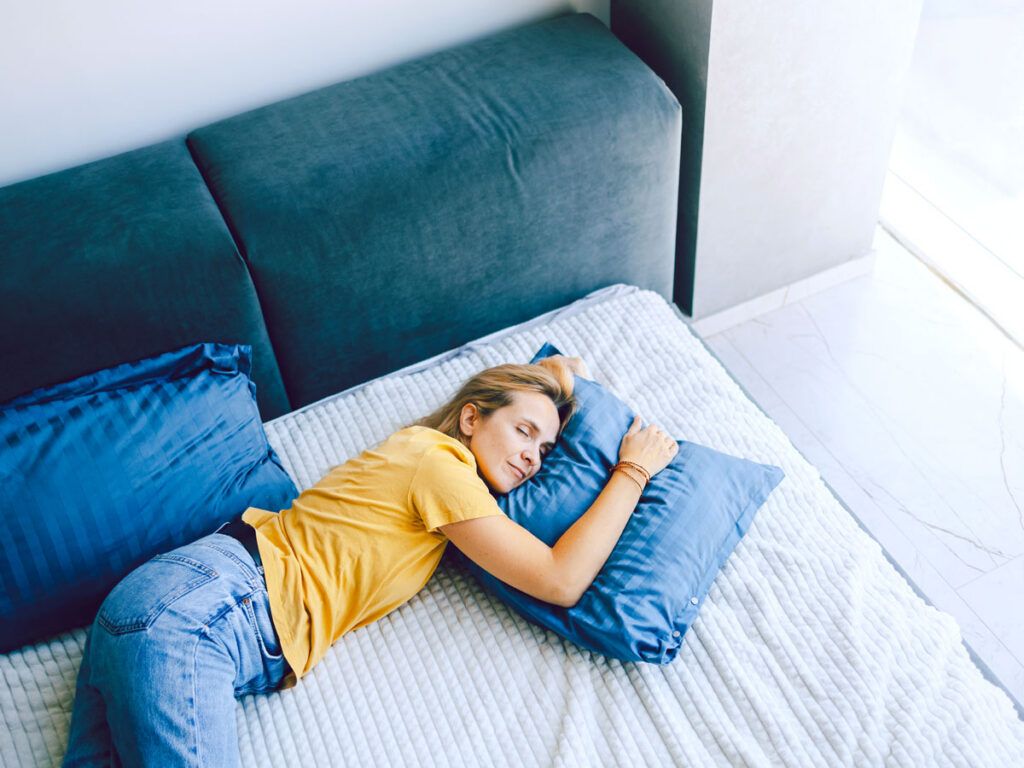 Woman lying on bed