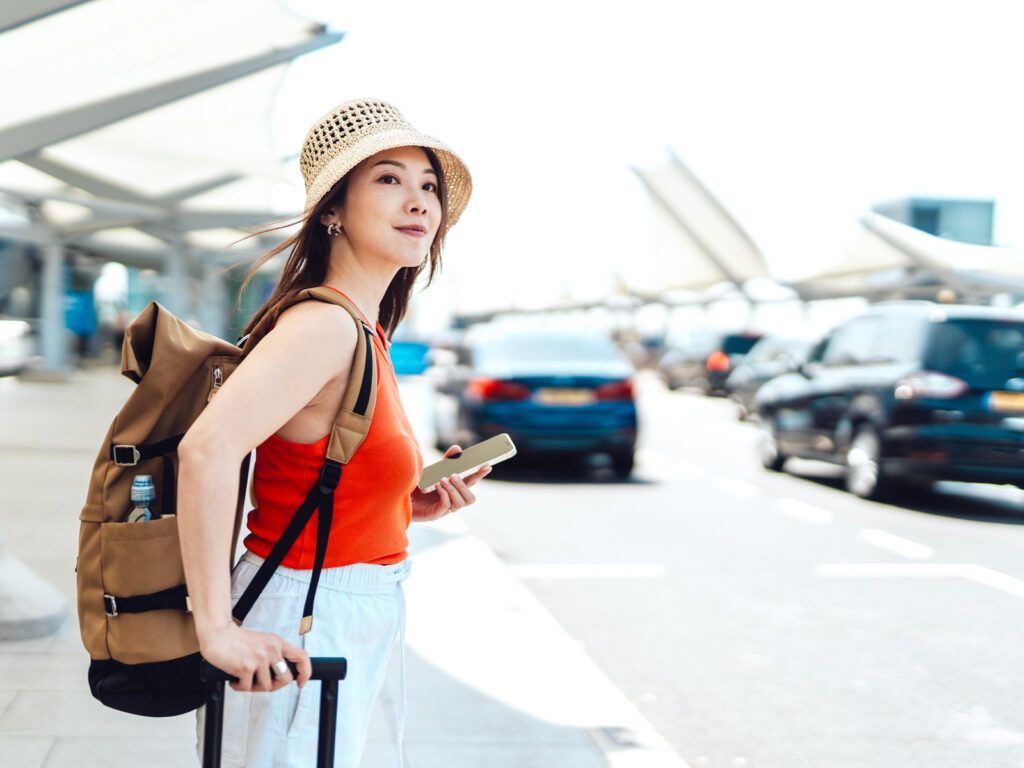 Woman waiting curbside at the airport