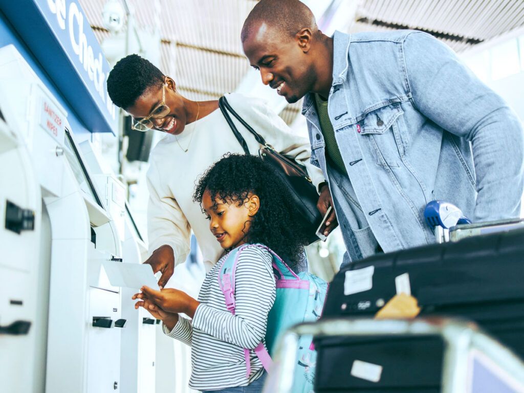 Parents with young child at airport check-in