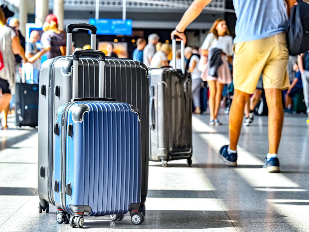 Close-up of suitcases in airport