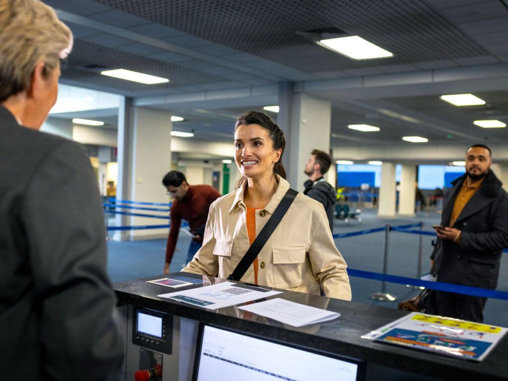 Airline passenger speaking with agent