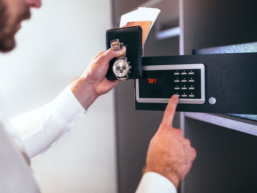 Hotel guest using safe in room