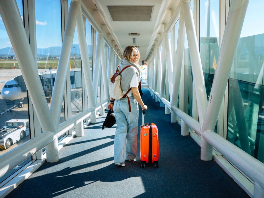 Woman in jetway boarding plane