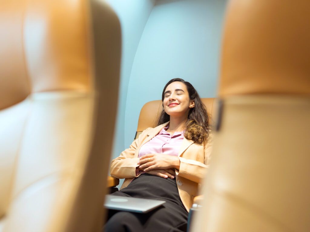 Traveler relaxing in business class