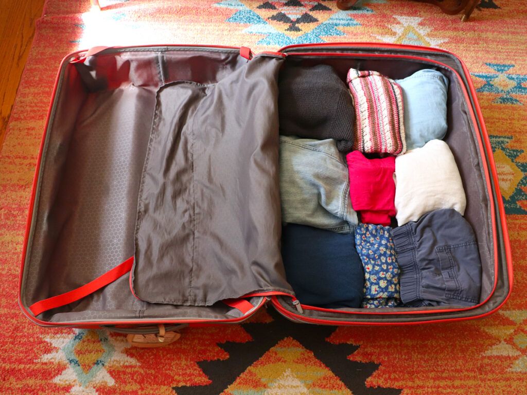 Orange suitcase featuring sudoku packing method