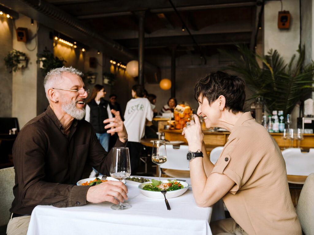 Couple dining with glasses of wine