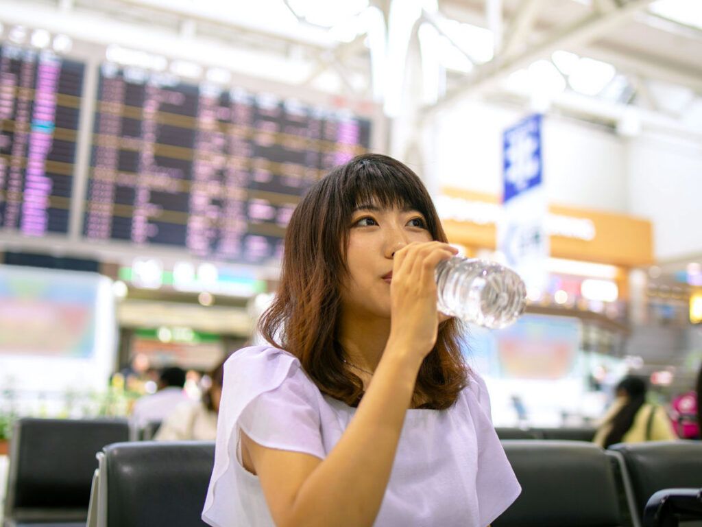 Woman drinking a bottle of water