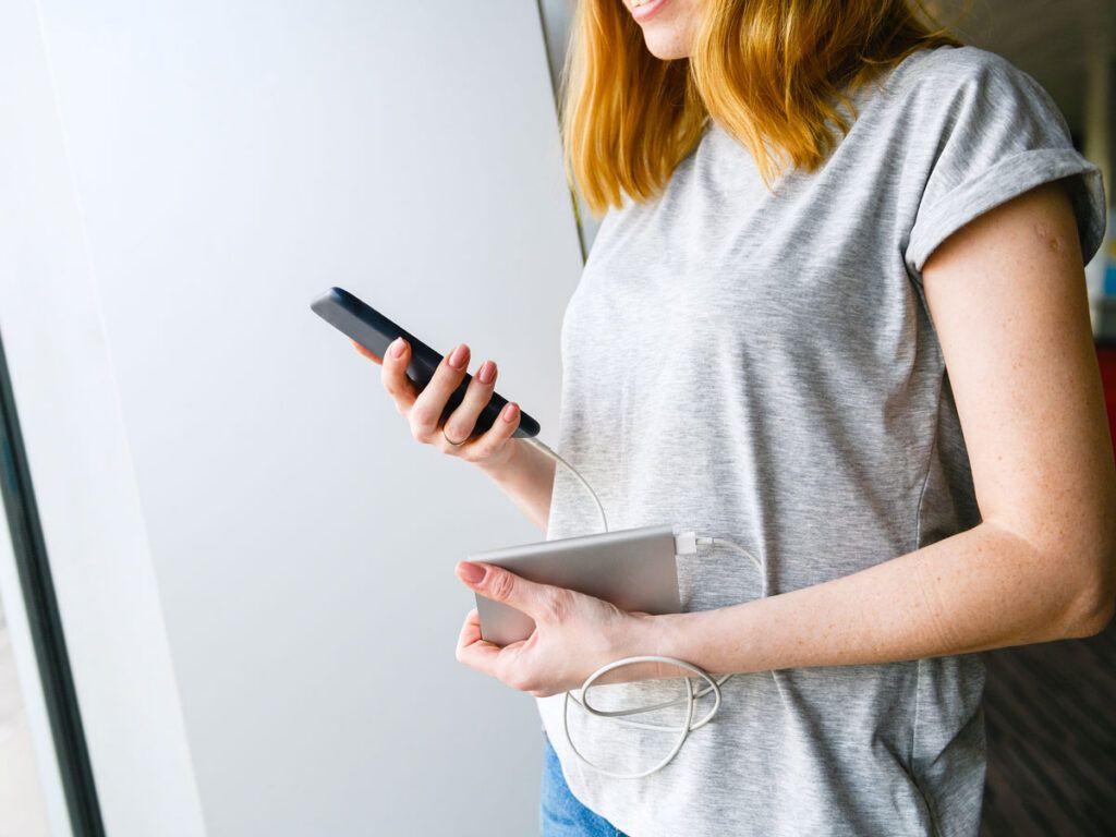 Woman charging her phone