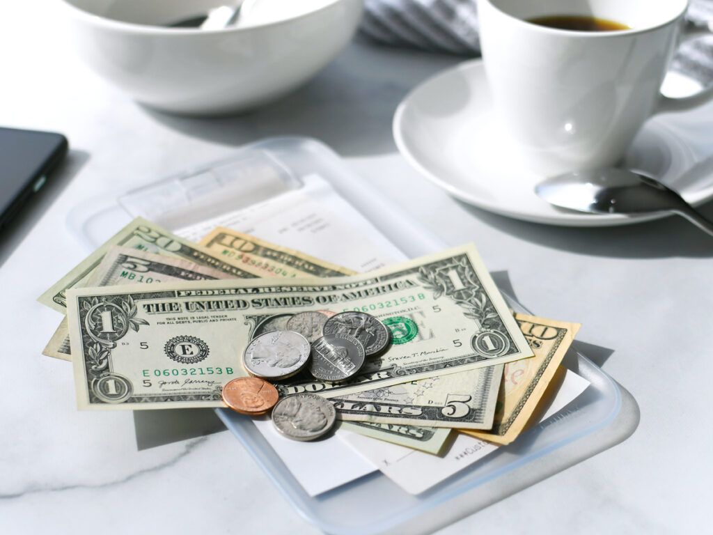 Paying for the bill at a restaurant with cash