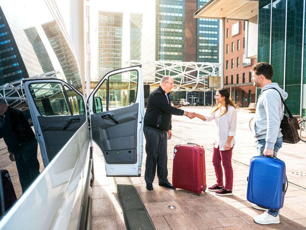 Airport shuttle driver and passengers