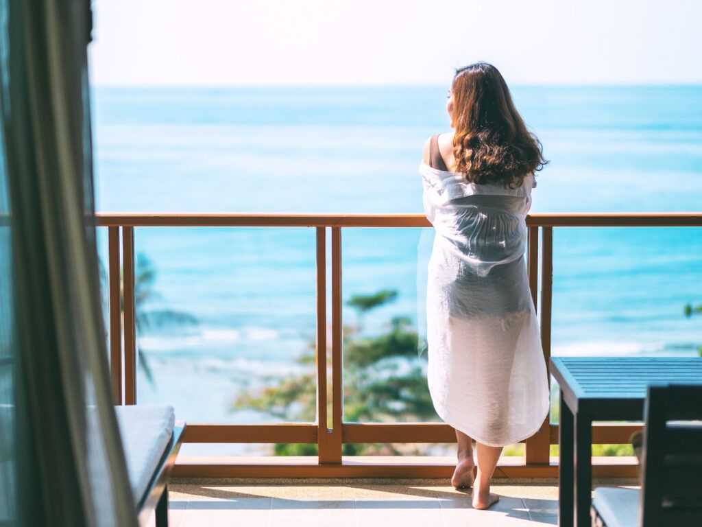 Guest enjoying the sea view on a balcony