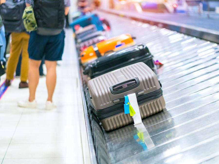 Suitcases on a conveyor belt in the airport