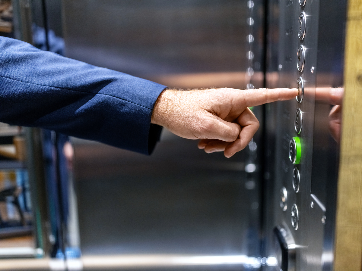 Pushing hotel elevator buttons
