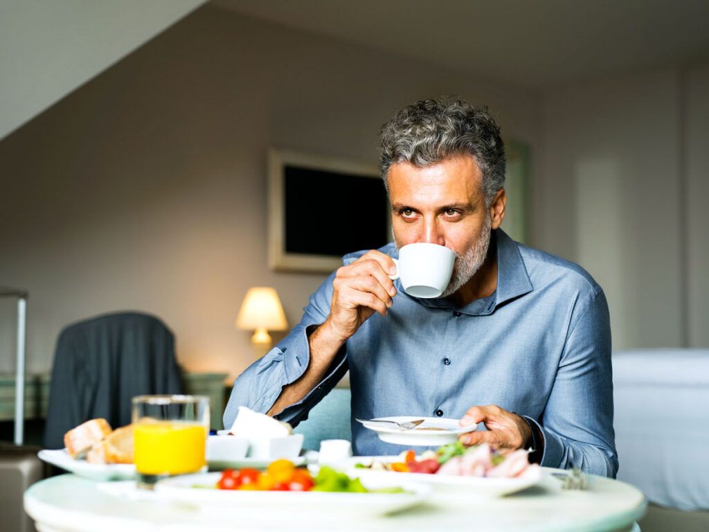 Man drinking a cup of coffee