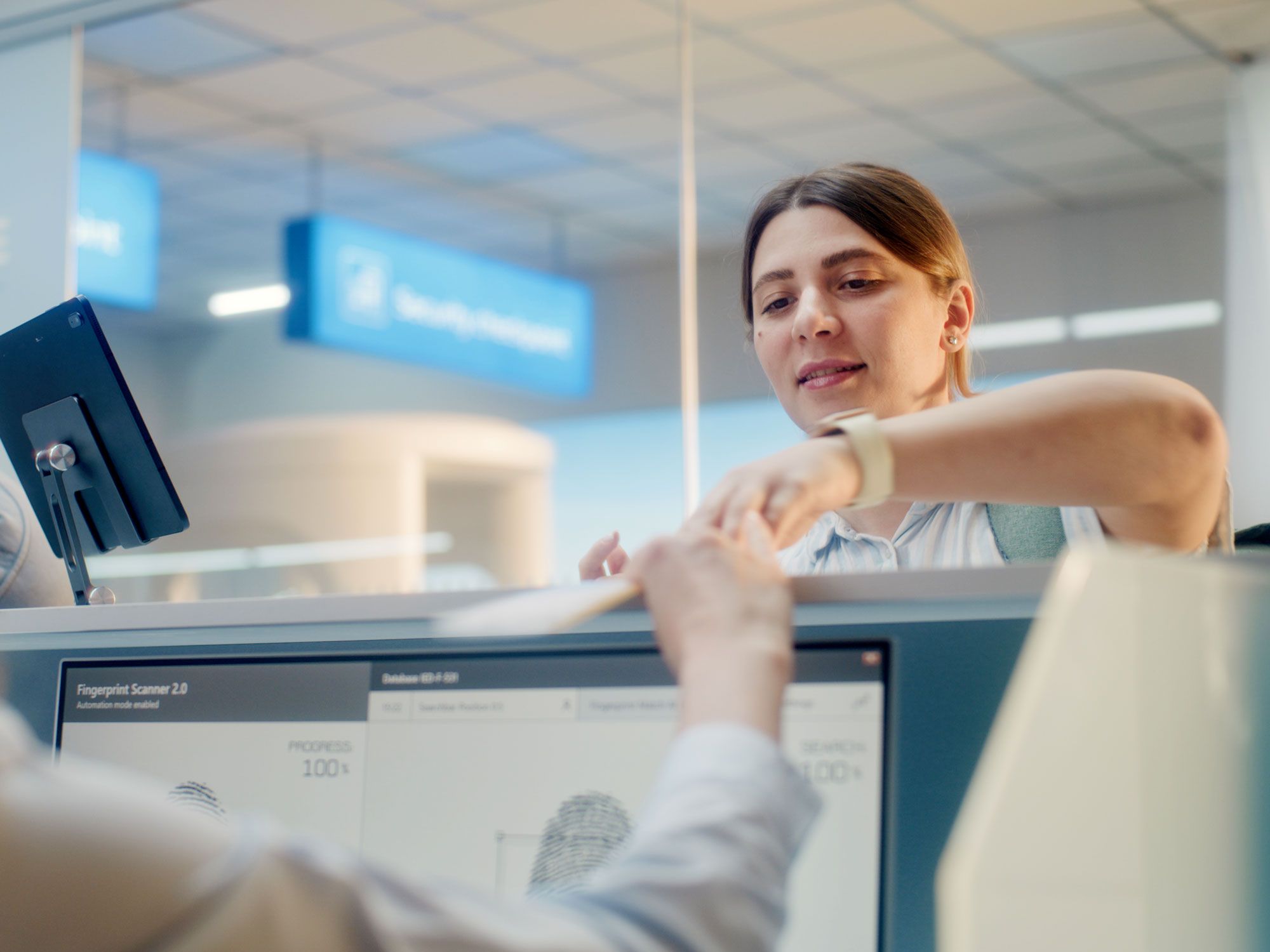 Airline passenger handing document to security officer