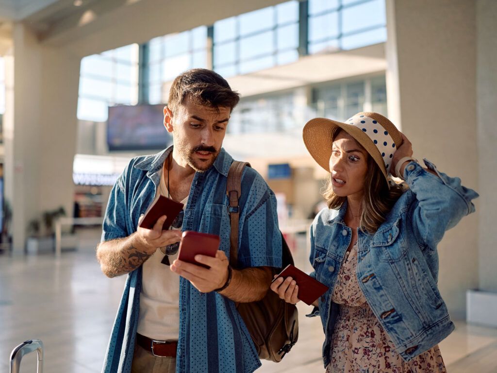 Couple traveling with their luggage
