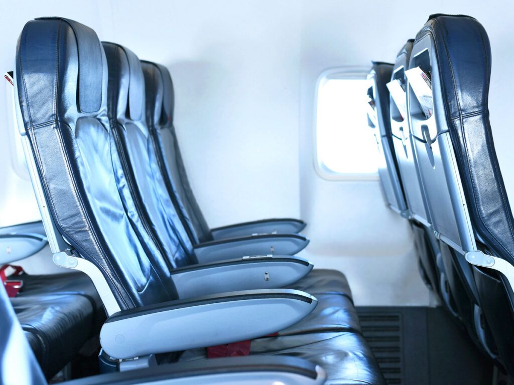 Row of economy seats on airplane