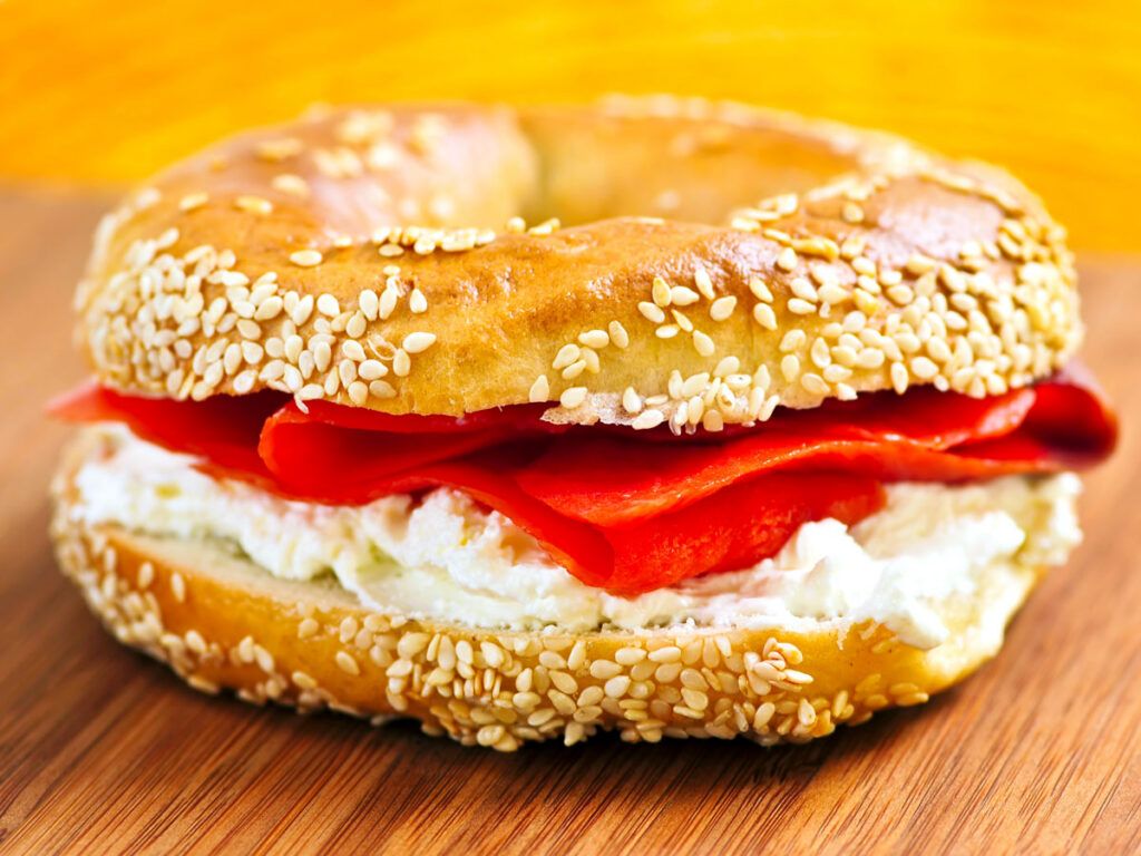Lox bagel featuring smoked salmon and schmear (cream cheese)