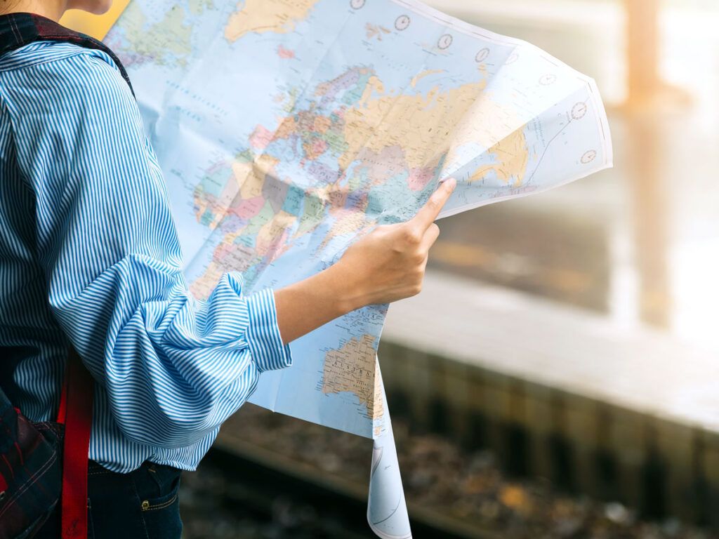 Tourist using a paper map to navigate