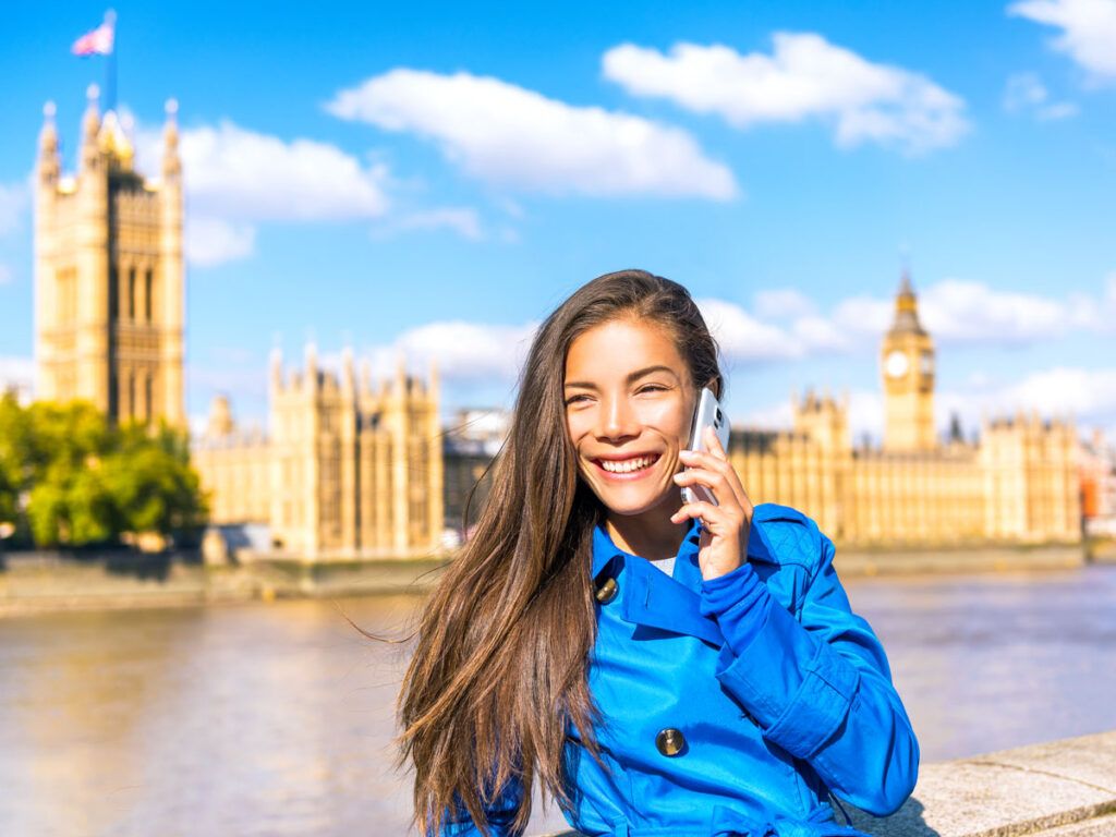 Woman calling on a phone in London, England