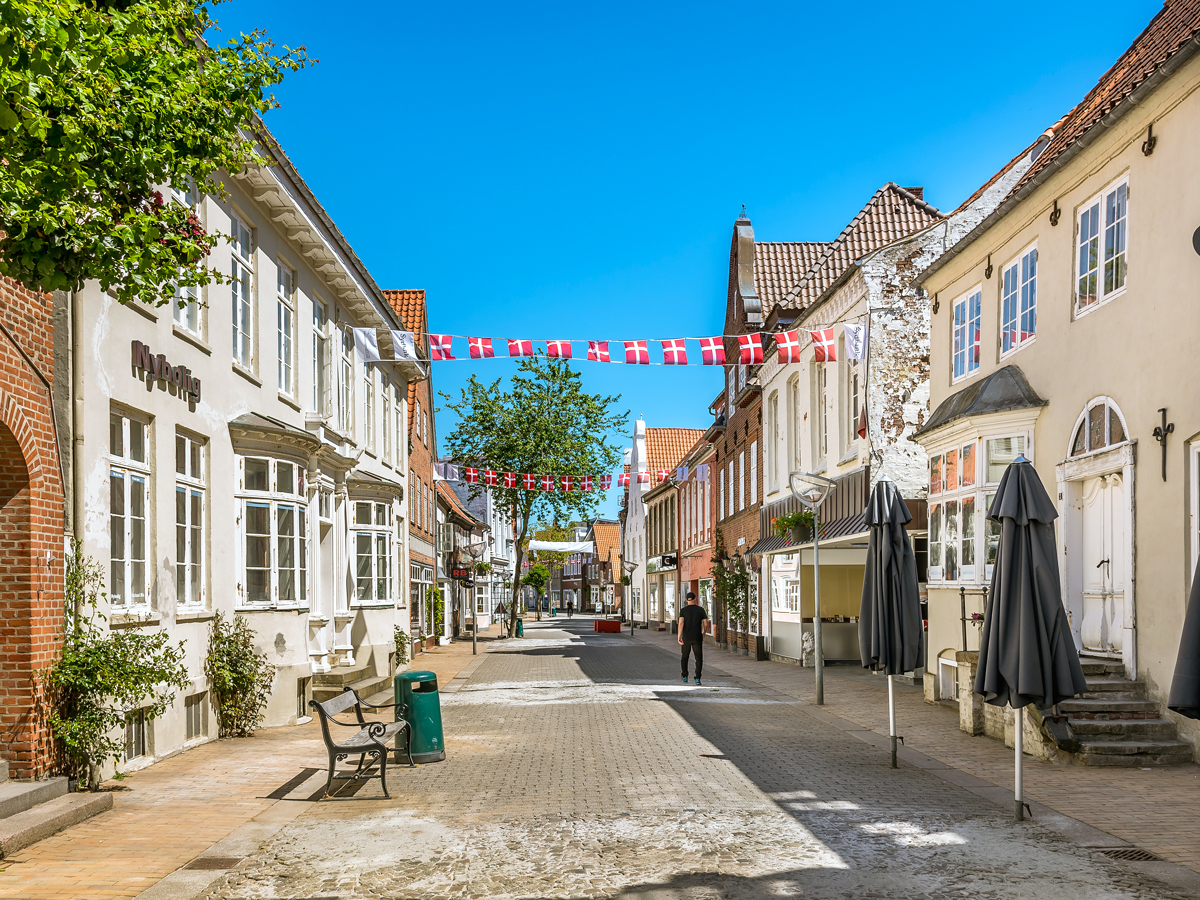 Street with hanging flags in Tønder, Denmark