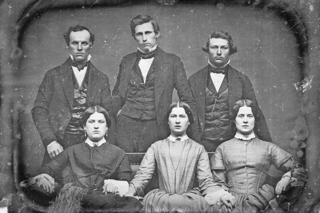 Americans pose in a photo