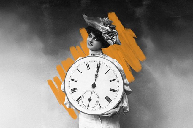 Woman holding clock