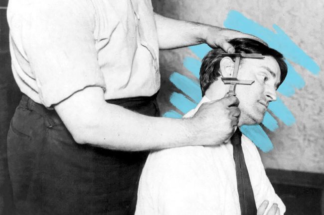 Officer measuring a prisoner's ear