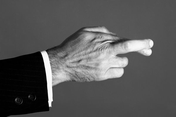 Man crossing his fingers