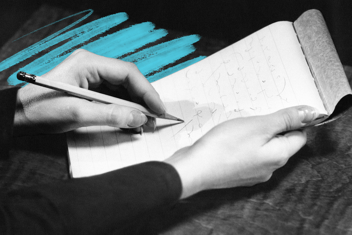 Stenographer's hands with pad and pencil