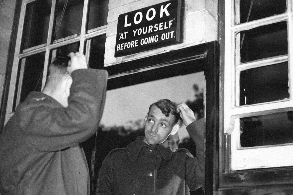 Soldier looks in mirror, c. 1950