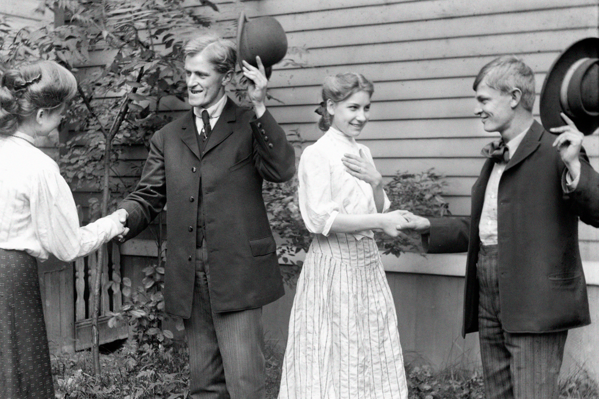 Two couples greeting, 1905