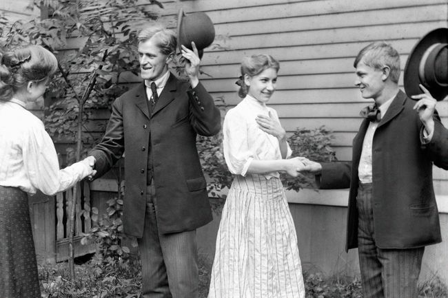Two couples greeting, 1905