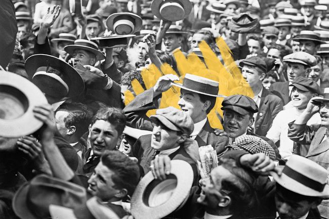 Crowd in New York City with men wearing straw hats
