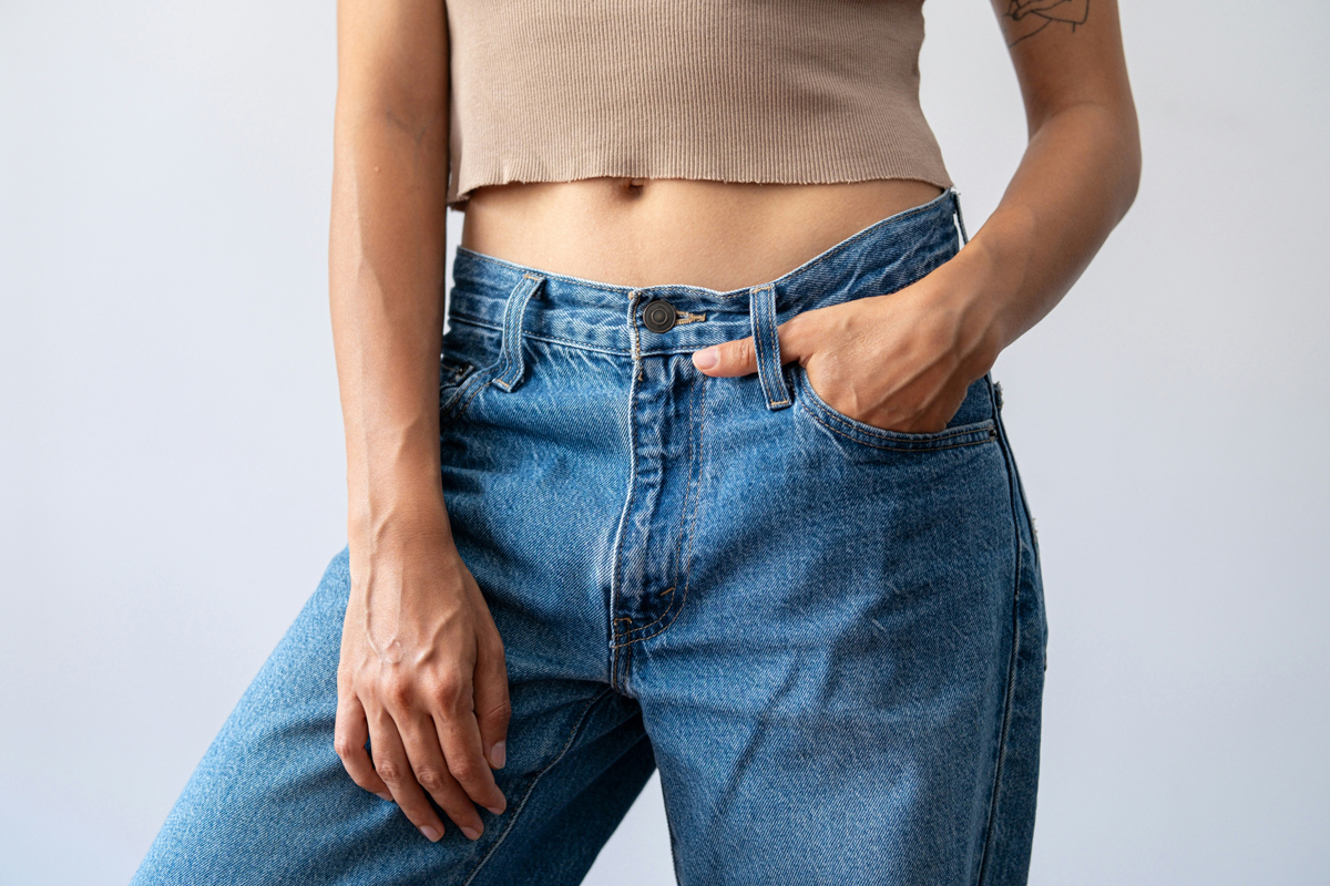 A close-up photo of the midsection of a woman's exposed belly button