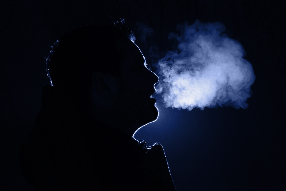 Person's breath fogging