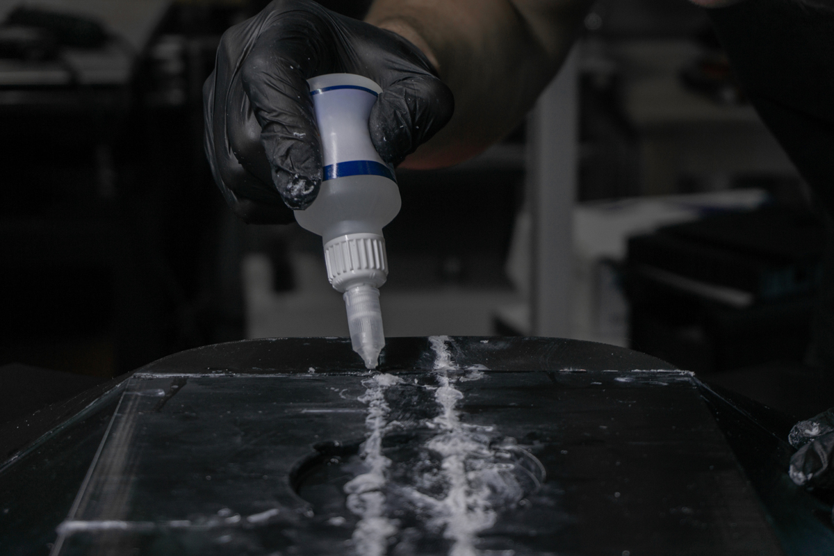 Superglue being applied to surface