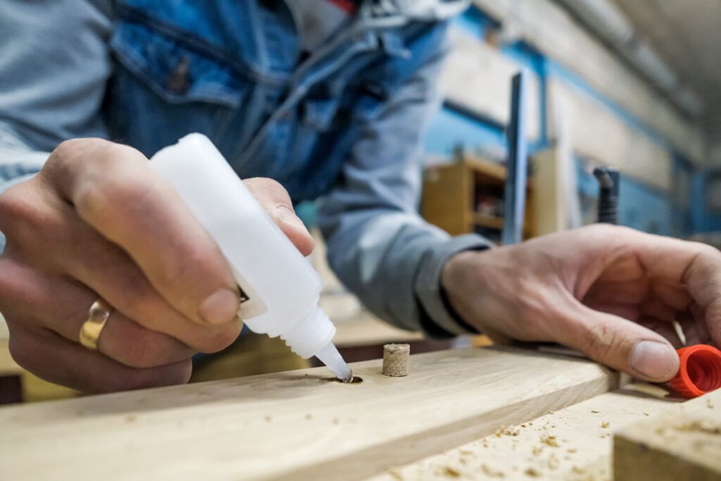 Person applying superglue