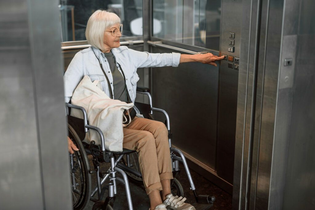 Woman in wheelchair in elevator