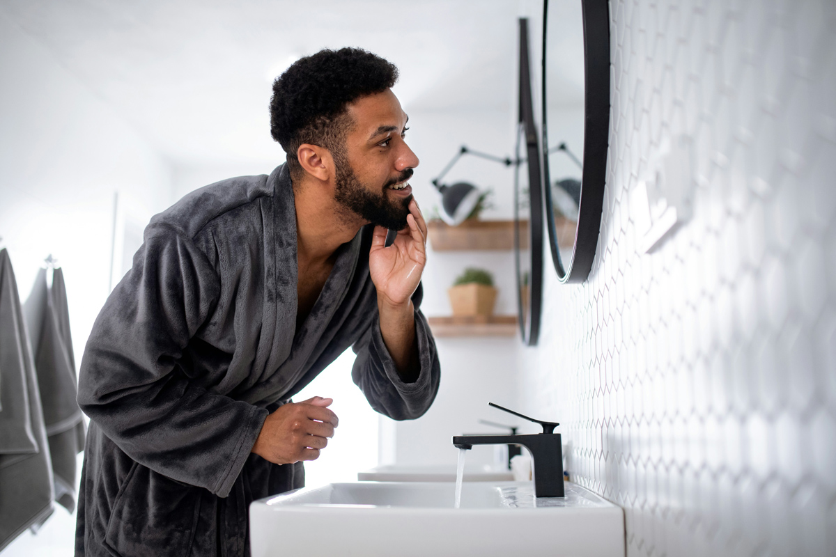 Person checking their reflection in a mirror