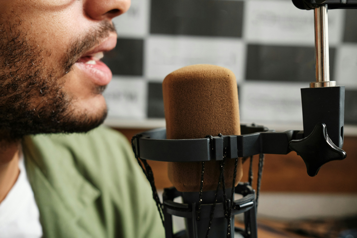 Person talking into a microphone