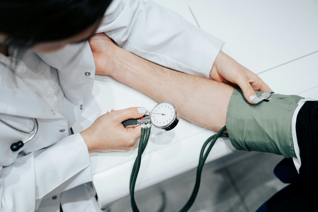 Doctor taking a patient's blood pressure