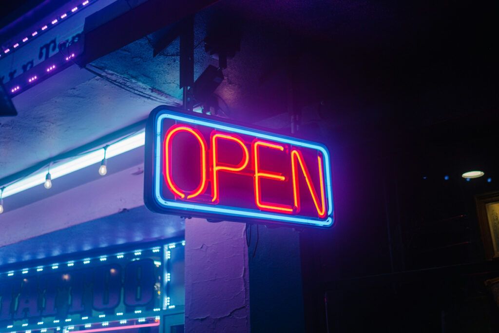 A neon sign reading "OPEN"