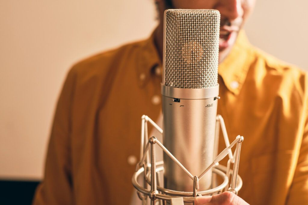 Person speaking in front of a microphone