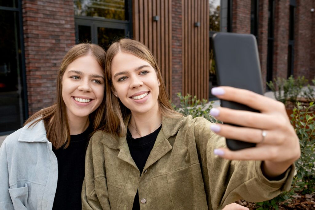 Twins taking a selfie