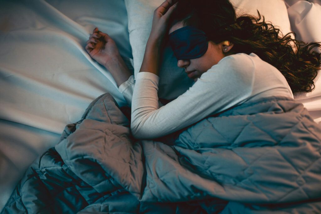 Person sleeping with eye mask