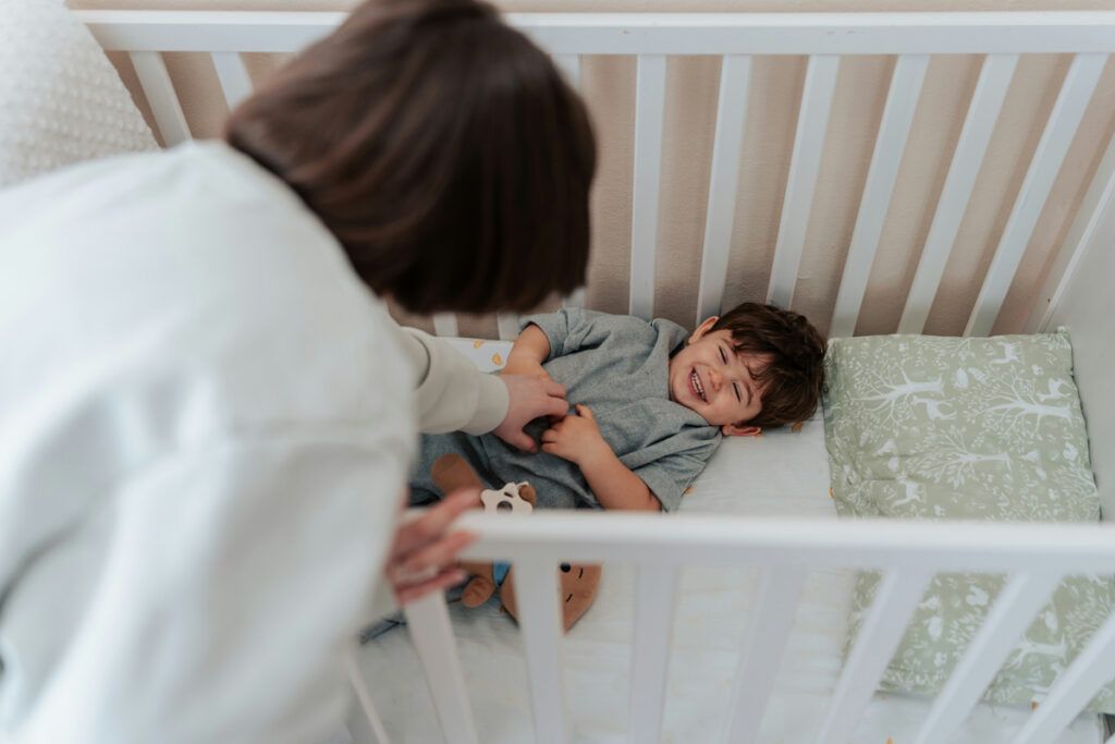 Adult tickling a child