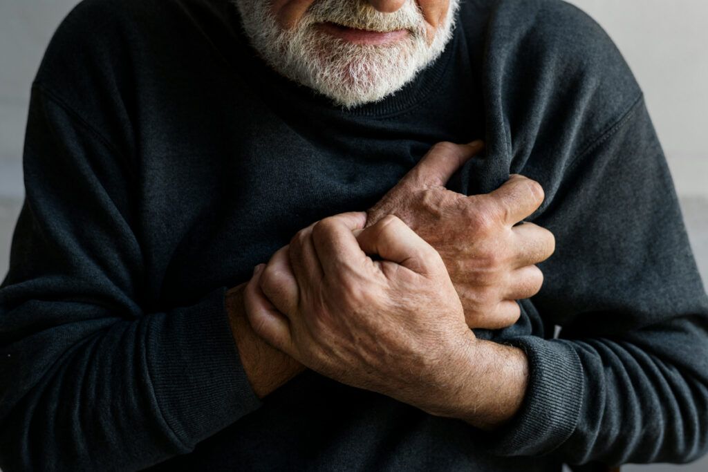 Person clutching chest