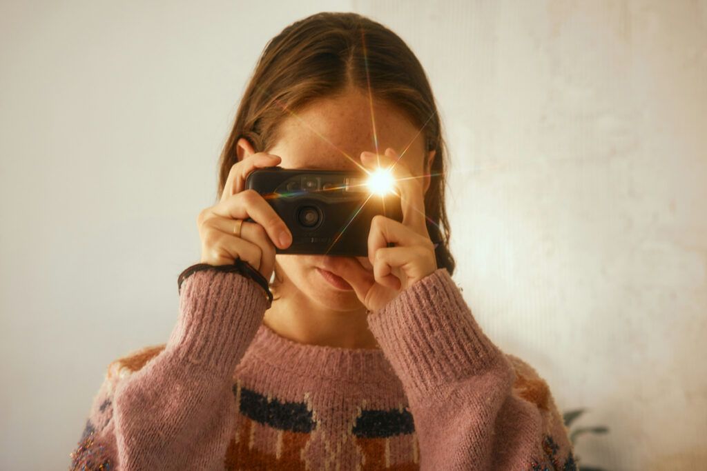 Person taking a flash photo